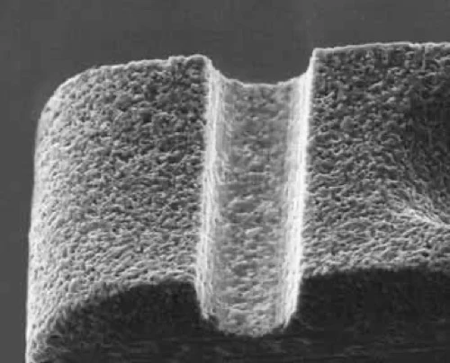 Scanning electron microscope image of a cross-groove bonding face.