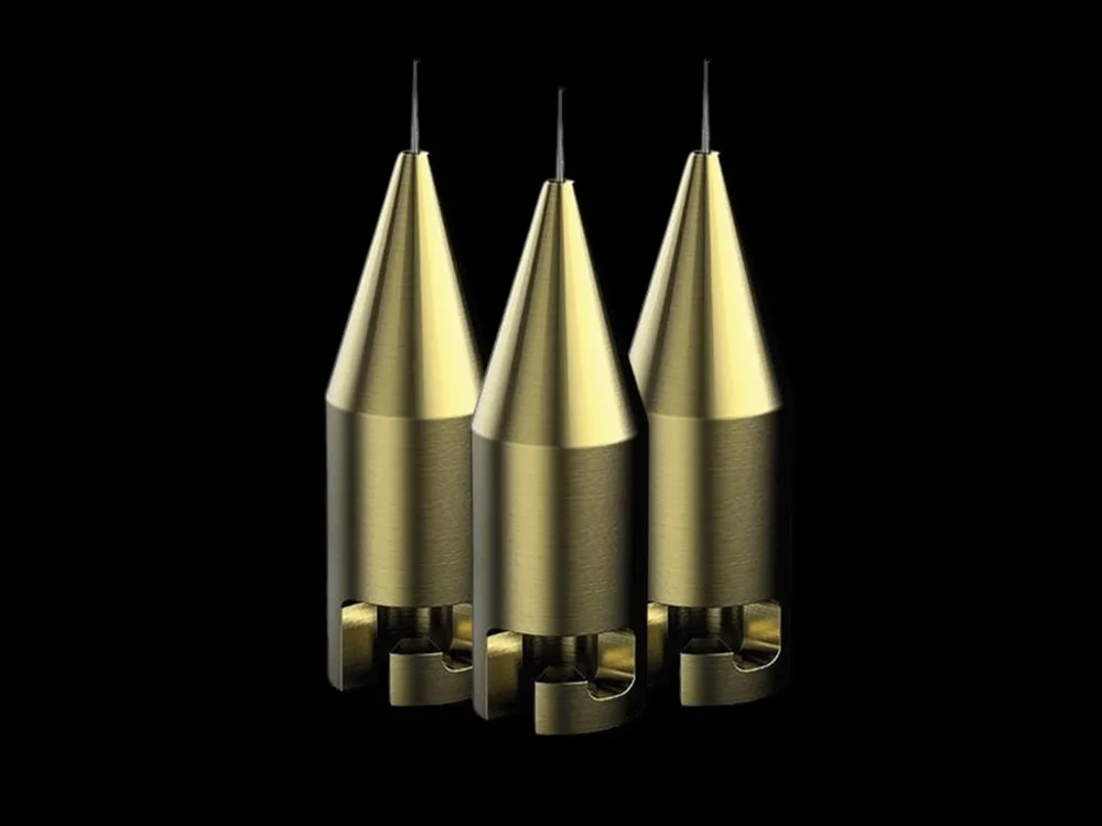 Three hook needles with brass bodies and fine steel tips.