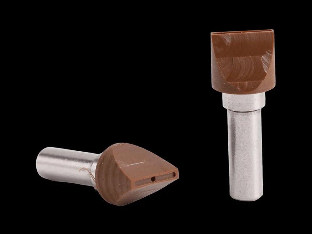 Bakelite pick-up nozzles with angled heads on steel shanks.